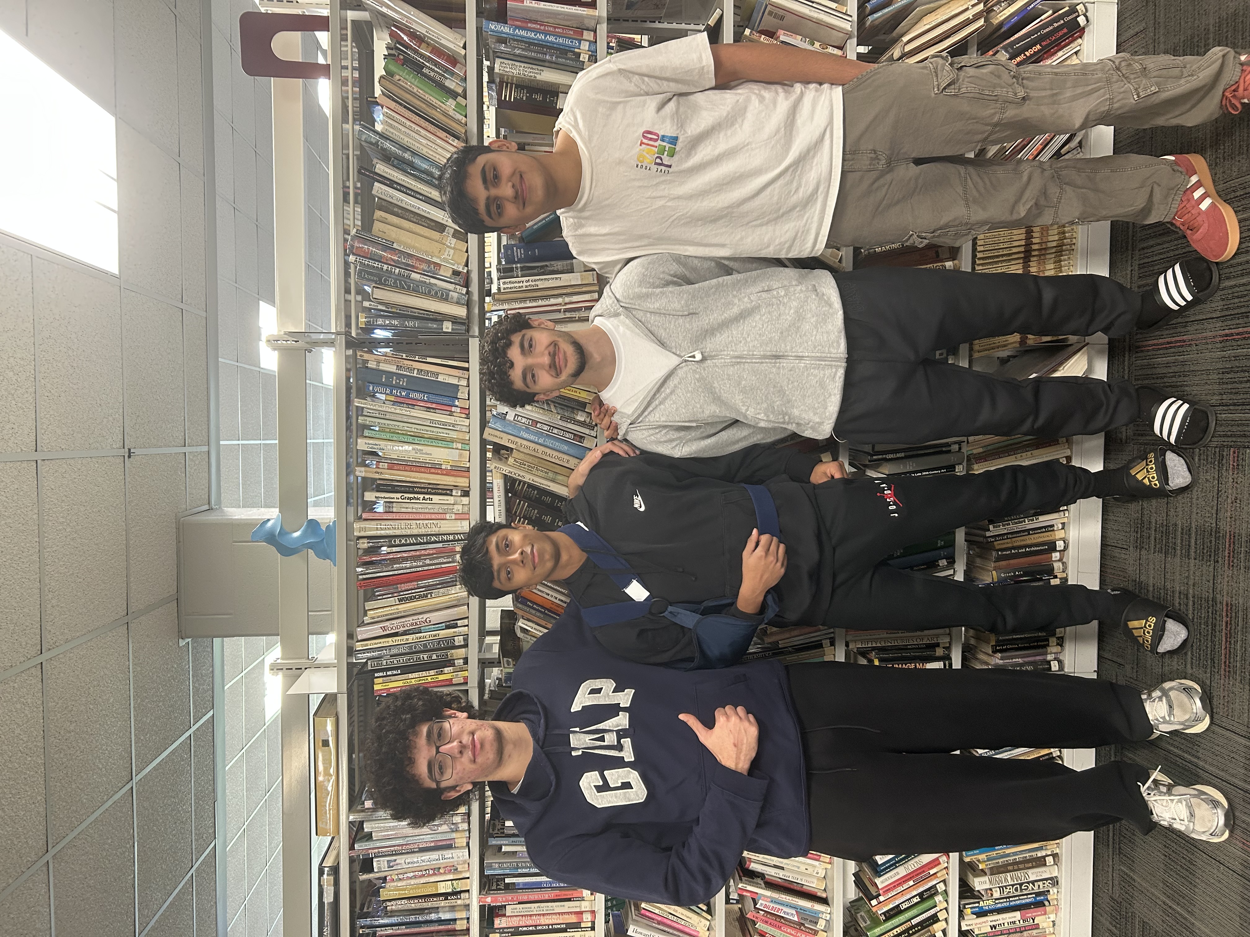 The VenoxAI team together in a library